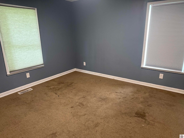 empty room featuring carpet flooring