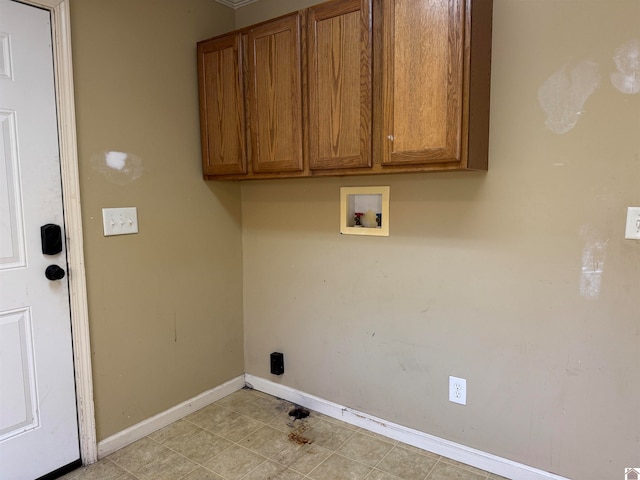 laundry room featuring cabinets, light tile patterned floors, and hookup for a washing machine