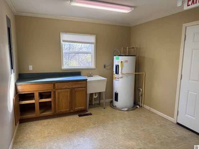 laundry area with ornamental molding and water heater