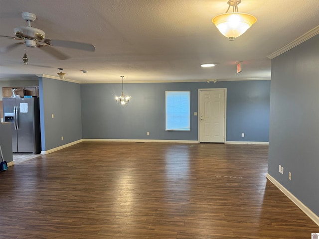 unfurnished living room featuring dark hardwood / wood-style floors, ornamental molding, and ceiling fan with notable chandelier