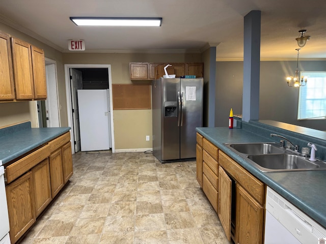 kitchen featuring sink, a notable chandelier, decorative light fixtures, white appliances, and ornamental molding