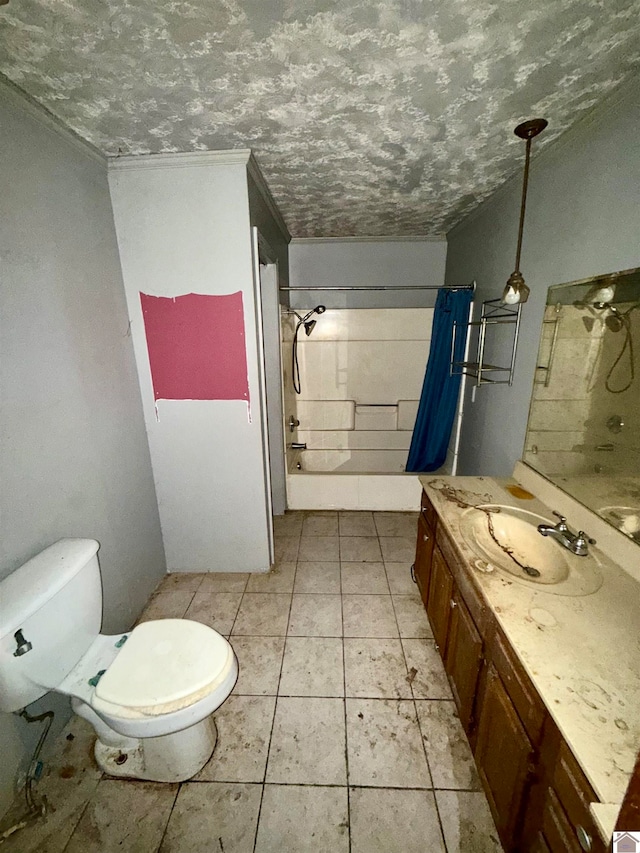 bathroom featuring tile patterned flooring, a textured ceiling, vanity, and toilet