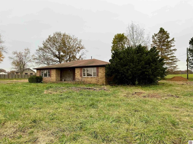 view of front of home with a front lawn