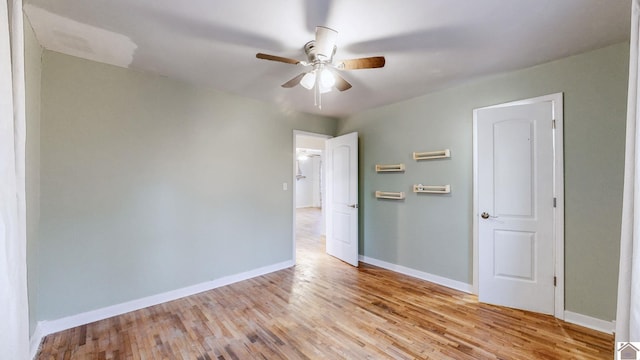 unfurnished room featuring ceiling fan and light wood-type flooring