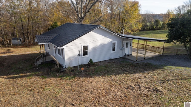 view of property exterior featuring a lawn