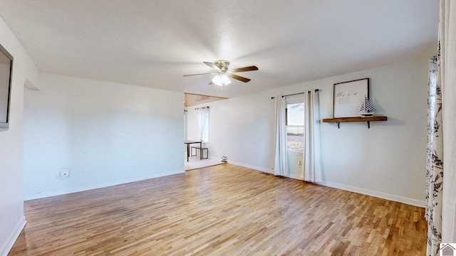 unfurnished room featuring ceiling fan and light wood-type flooring