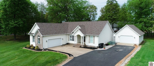 view of front of house featuring a front yard and central AC