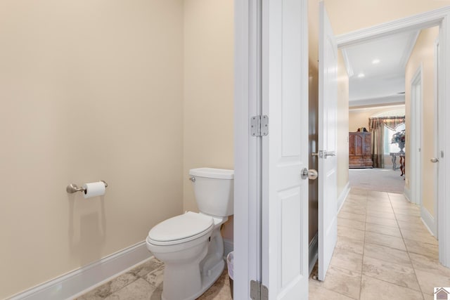 bathroom featuring tile patterned flooring and toilet