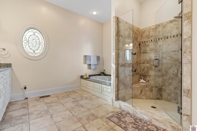 bathroom with separate shower and tub and vanity