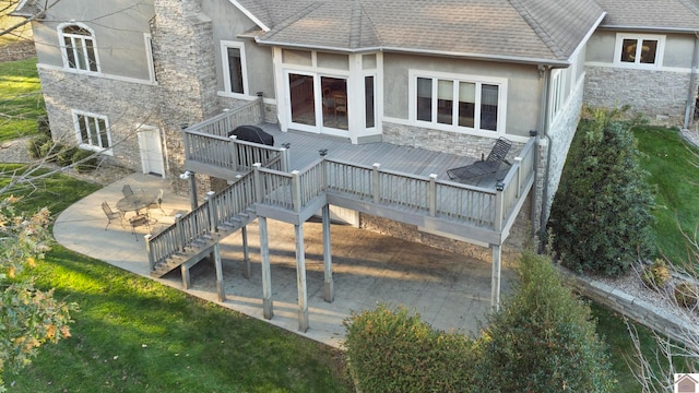 rear view of house with a patio and a deck