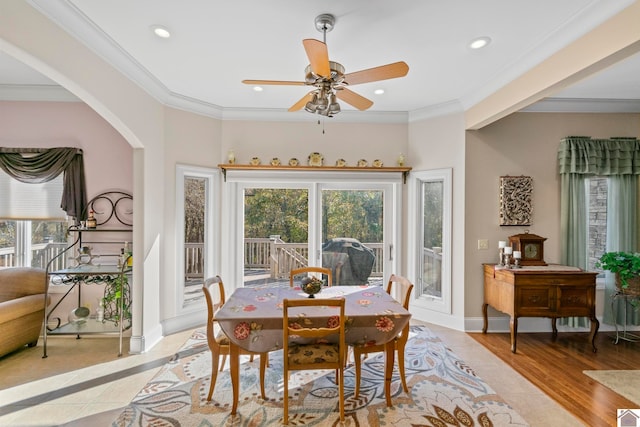 dining room with ceiling fan, light hardwood / wood-style flooring, and ornamental molding