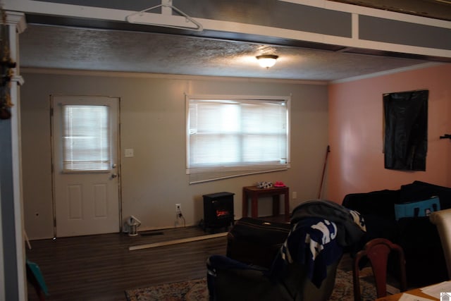 living room featuring hardwood / wood-style floors and crown molding