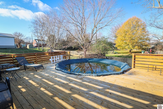 view of pool featuring a wooden deck