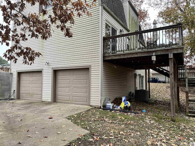 210 Banberry Bnd, Paducah, KY 42001 - view of side of property featuring a garage, a deck, and central AC