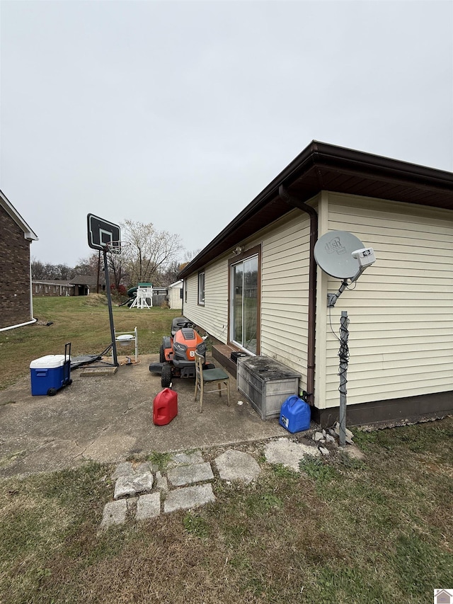 view of side of property with a yard