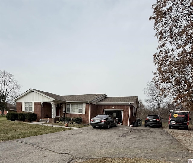 single story home with a garage and a front yard