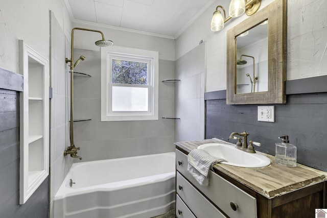 bathroom featuring backsplash, vanity, ornamental molding, and tiled shower / bath