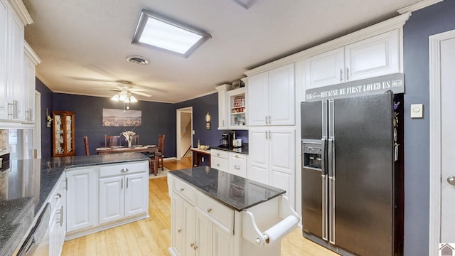 155 County Line Rd, Paducah, KY 42003 - kitchen with black fridge, light wood-type flooring, white cabinetry, dishwasher, and ornamental molding