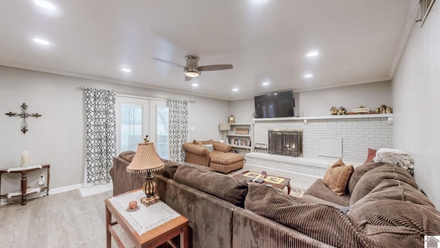 155 County Line Rd, Paducah, KY 42003 - living room featuring a ceiling fan, ornamental molding, light wood-style floors, a brick fireplace, and recessed lighting
