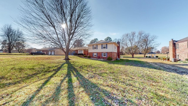 155 County Line Rd, Paducah, KY 42003 - view of front of house featuring brick siding, a chimney, and a front yard