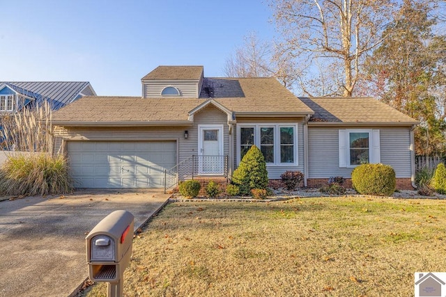 view of front of home featuring a garage and a front yard