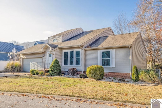 single story home with a front yard and a garage