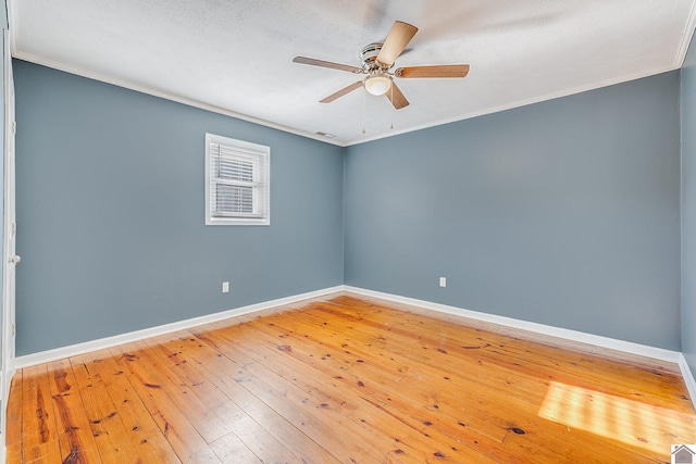 empty room featuring hardwood / wood-style floors, a textured ceiling, ceiling fan, and ornamental molding