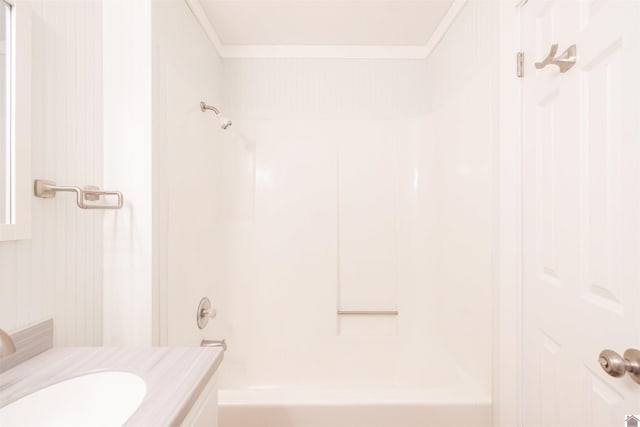 bathroom featuring vanity, shower / bath combination, and crown molding