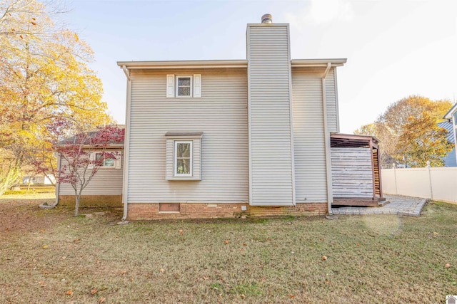 view of property exterior featuring a lawn