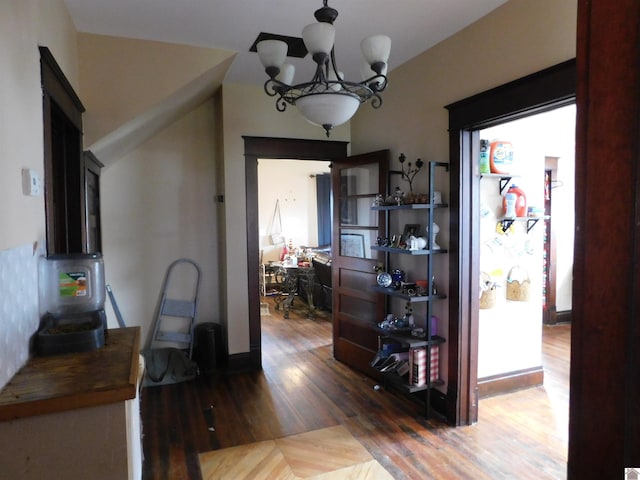 dining space featuring a notable chandelier and dark hardwood / wood-style floors