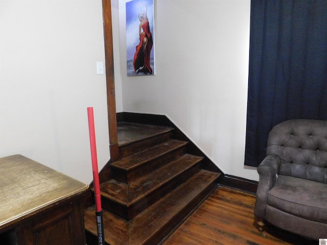 stairway featuring hardwood / wood-style flooring