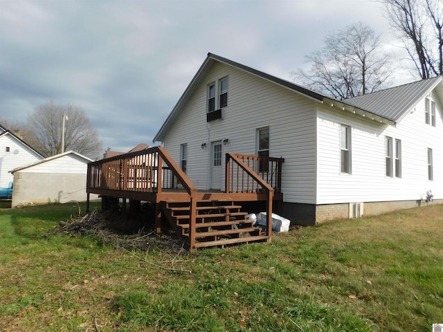 back of house with a lawn and a wooden deck