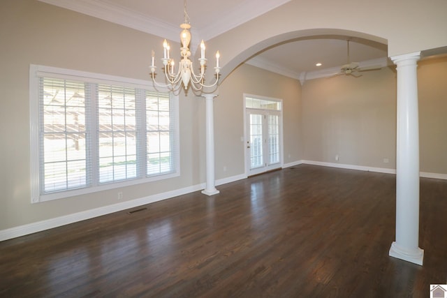 empty room with decorative columns, crown molding, dark hardwood / wood-style flooring, and ceiling fan with notable chandelier