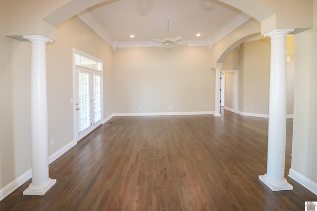 unfurnished living room featuring ornate columns, ceiling fan, dark hardwood / wood-style flooring, and ornamental molding