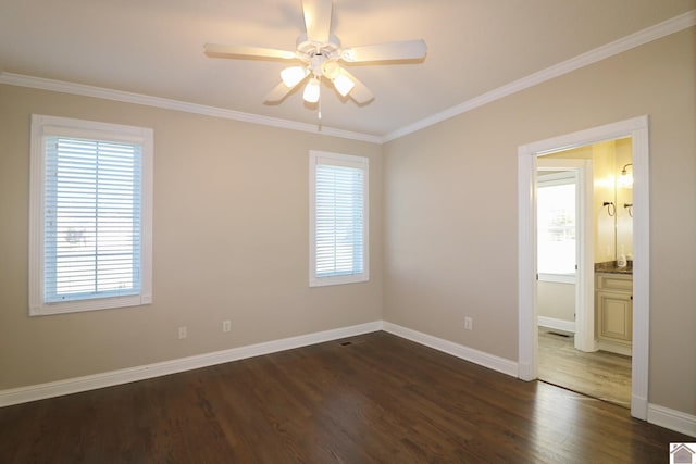 spare room with dark hardwood / wood-style flooring, ceiling fan, and crown molding