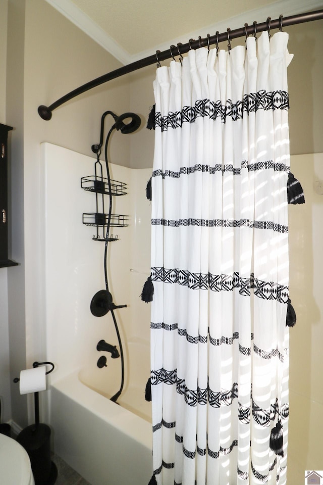 bathroom with shower / bath combination with curtain and crown molding