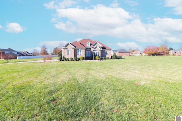 single story home with a front yard