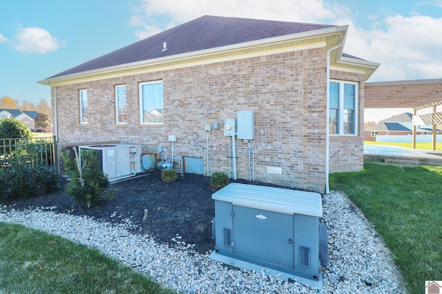 rear view of house featuring a yard