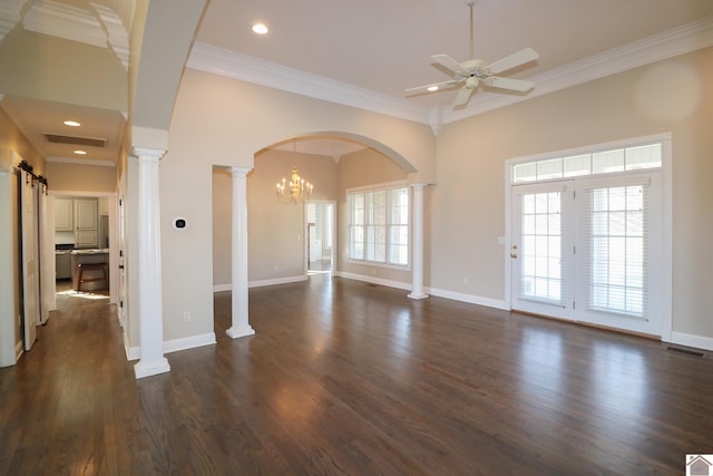 spare room with crown molding, dark hardwood / wood-style flooring, a healthy amount of sunlight, and ceiling fan with notable chandelier