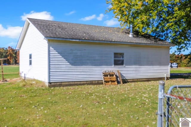 view of property exterior with a lawn