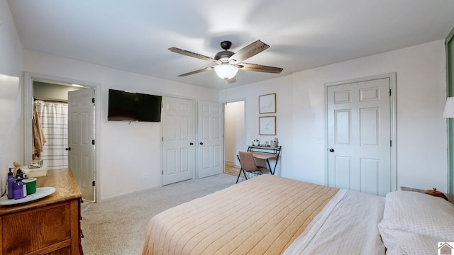 bedroom with ceiling fan and light carpet