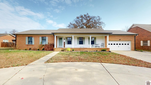 ranch-style home featuring a porch, a garage, and a front lawn