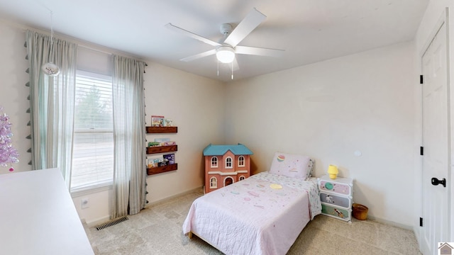 carpeted bedroom with ceiling fan