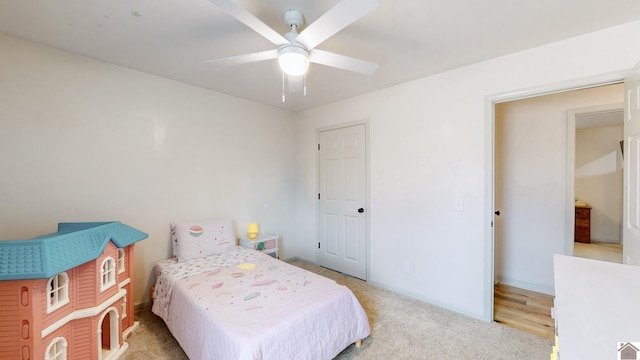 carpeted bedroom with ceiling fan