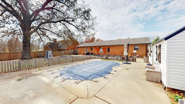 view of swimming pool with a patio