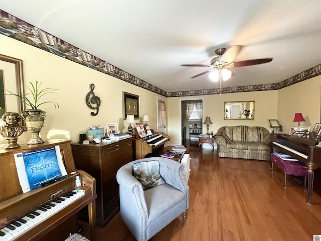 living room with hardwood / wood-style floors and ceiling fan