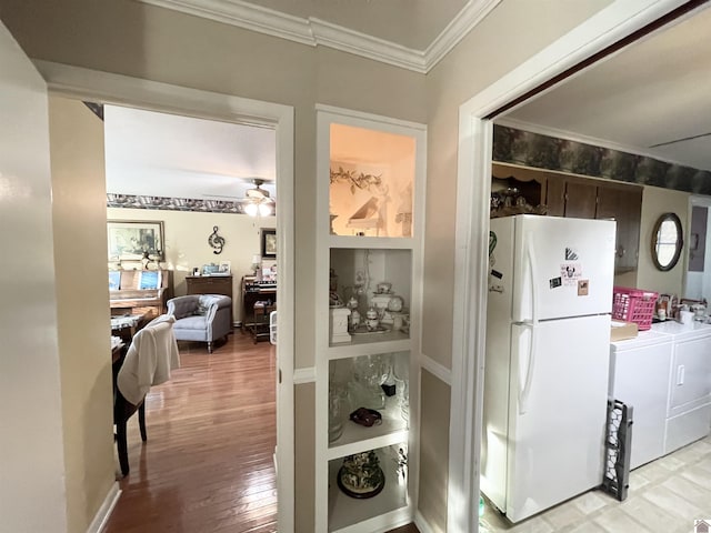 kitchen with ceiling fan, separate washer and dryer, crown molding, white fridge, and light hardwood / wood-style floors