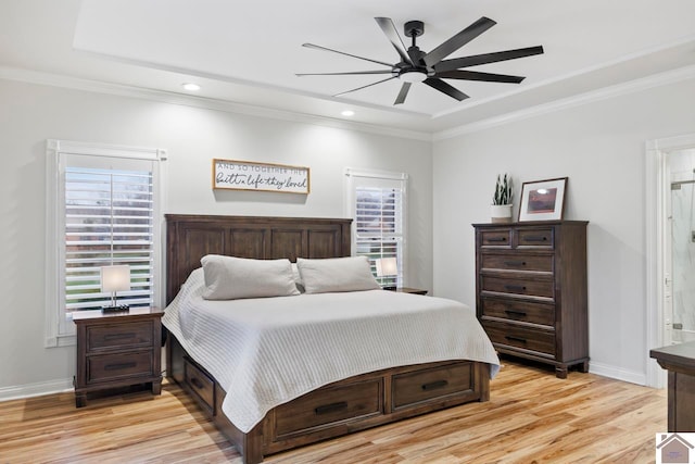 bedroom with multiple windows, ceiling fan, and light wood-type flooring