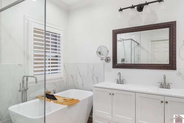 bathroom featuring crown molding, vanity, tile walls, and shower with separate bathtub