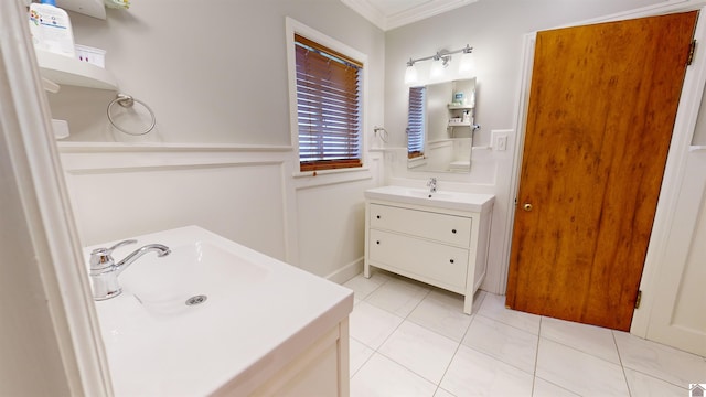 bathroom featuring tile patterned floors, vanity, and ornamental molding